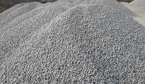 What is the role of pebbles in water filtration systems?
